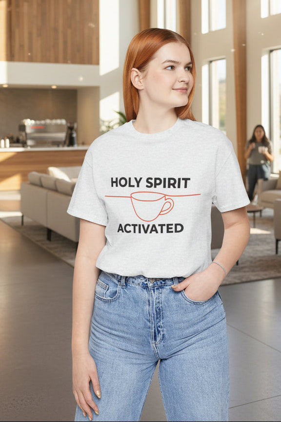 Person wearing a white t-shirt with a graphic and text, standing against a white background