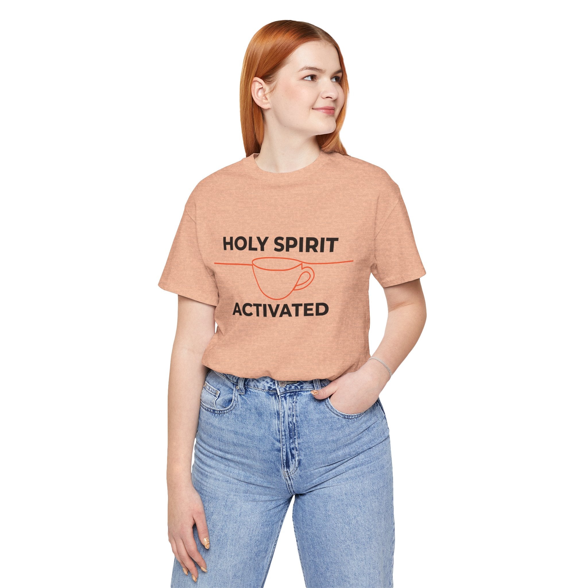 Person wearing a peach t-shirt with 'Holy Spirit Activated' text on a white background