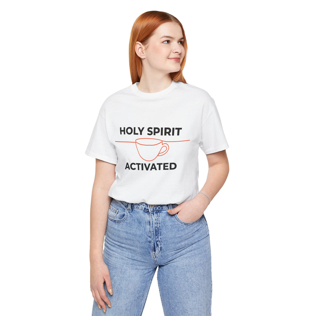 Person wearing a cream t-shirt with a purple rainbow design and text on a white background