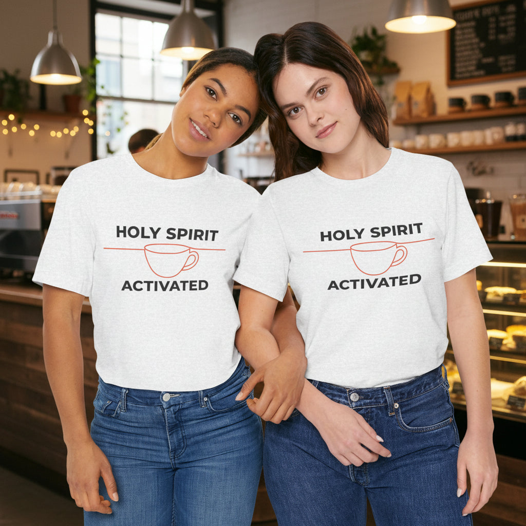 Two women wearing matching t-shirts with 'Holy Spirit Activated' text and graphics on a white background.