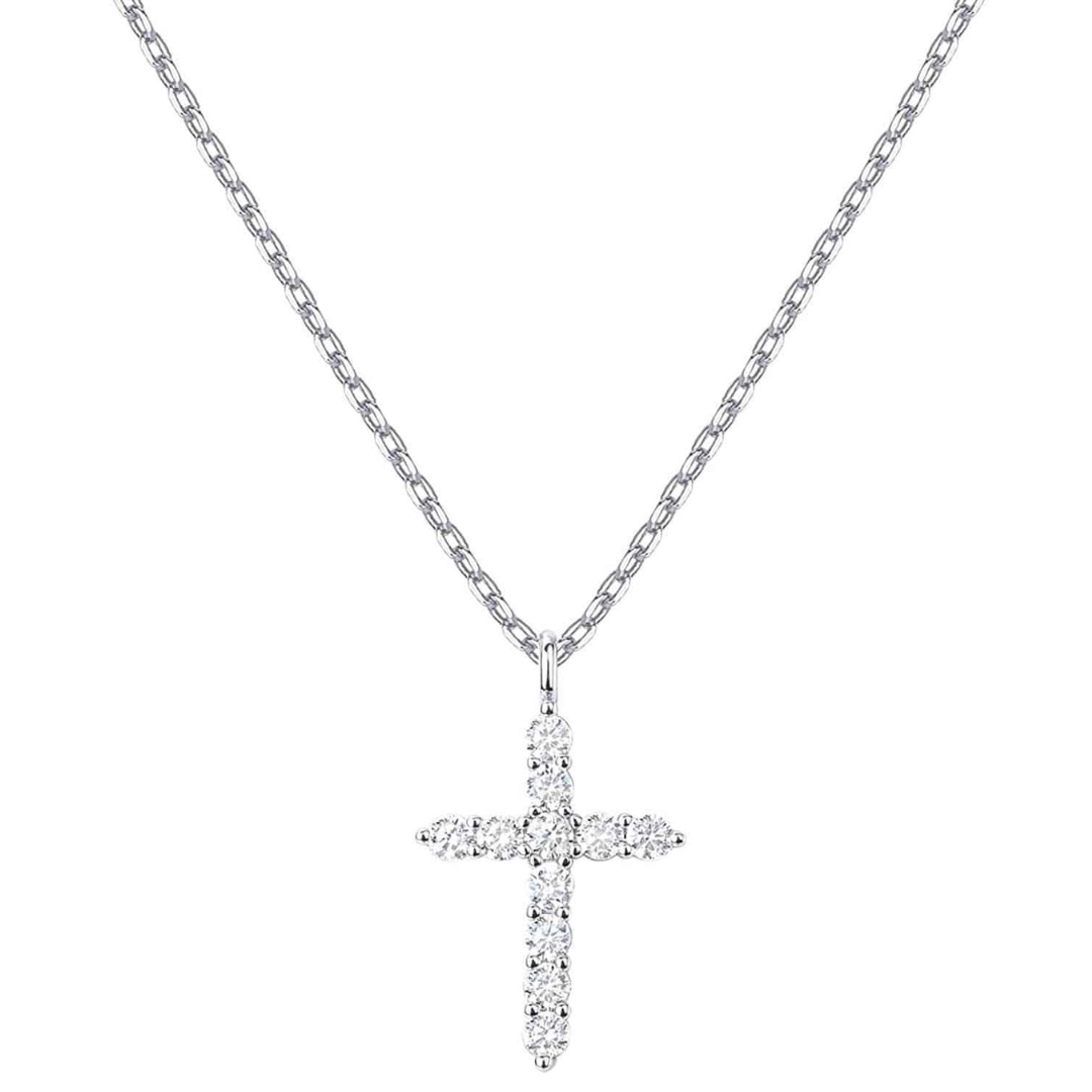 Silver cross pendant necklace on a white chain against a white background