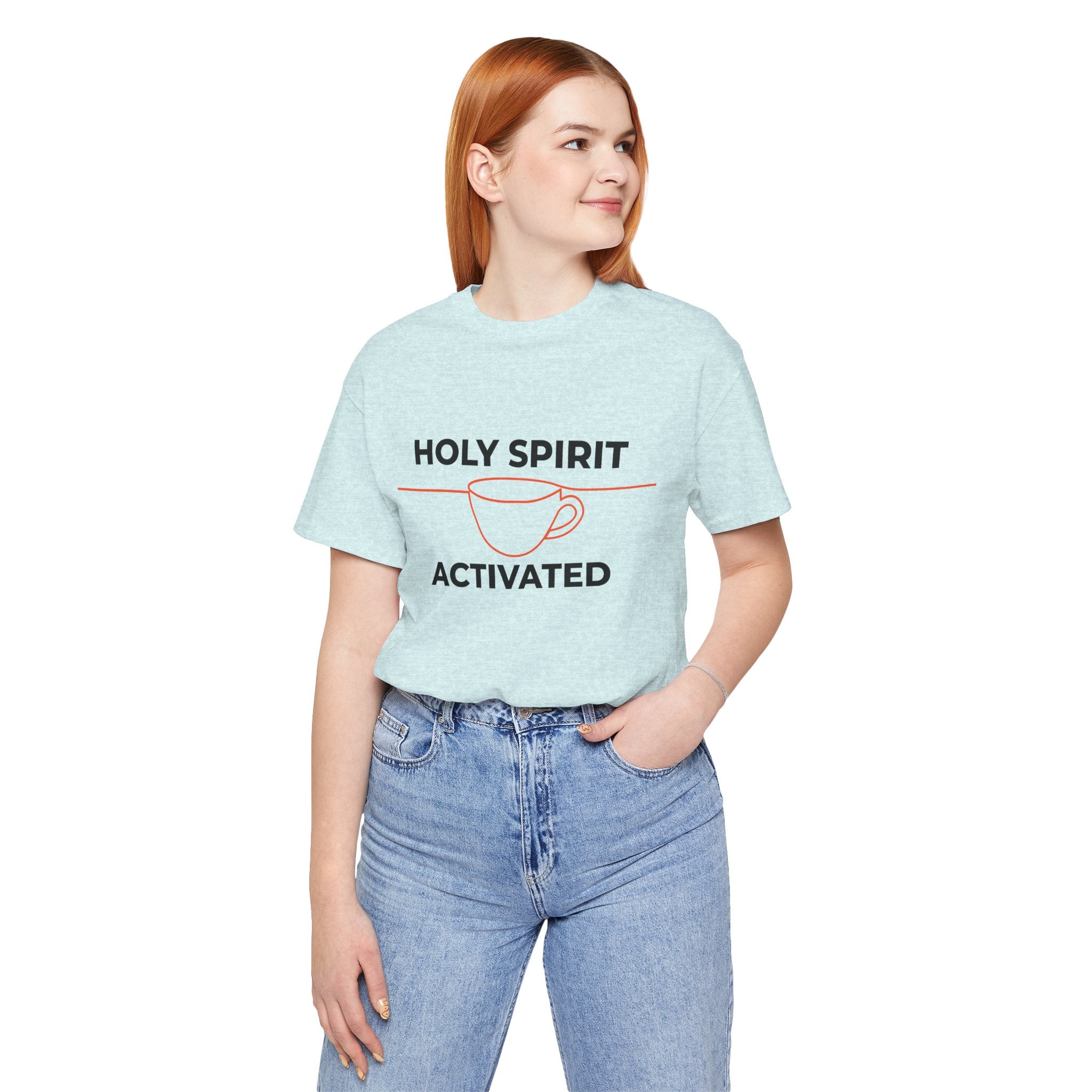 Person wearing a light blue t-shirt with 'Holy Spirit Activated' text and a coffee cup graphic.