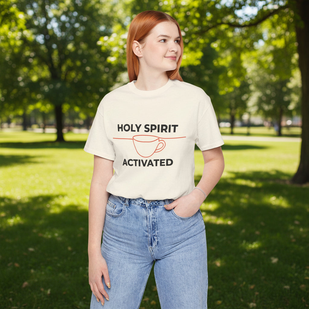 Person wearing a cream t-shirt with 'Holy Spirit Activated' text on a white background
