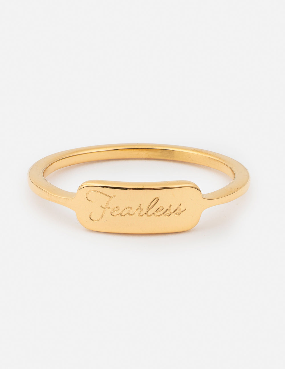 Gold ring with 'Fearless' engraving on a white background