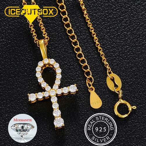Gold necklace with an ankh pendant on a black background, featuring 'Ice Out Box' branding.
