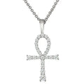 Diamond-studded cross pendant on a white background