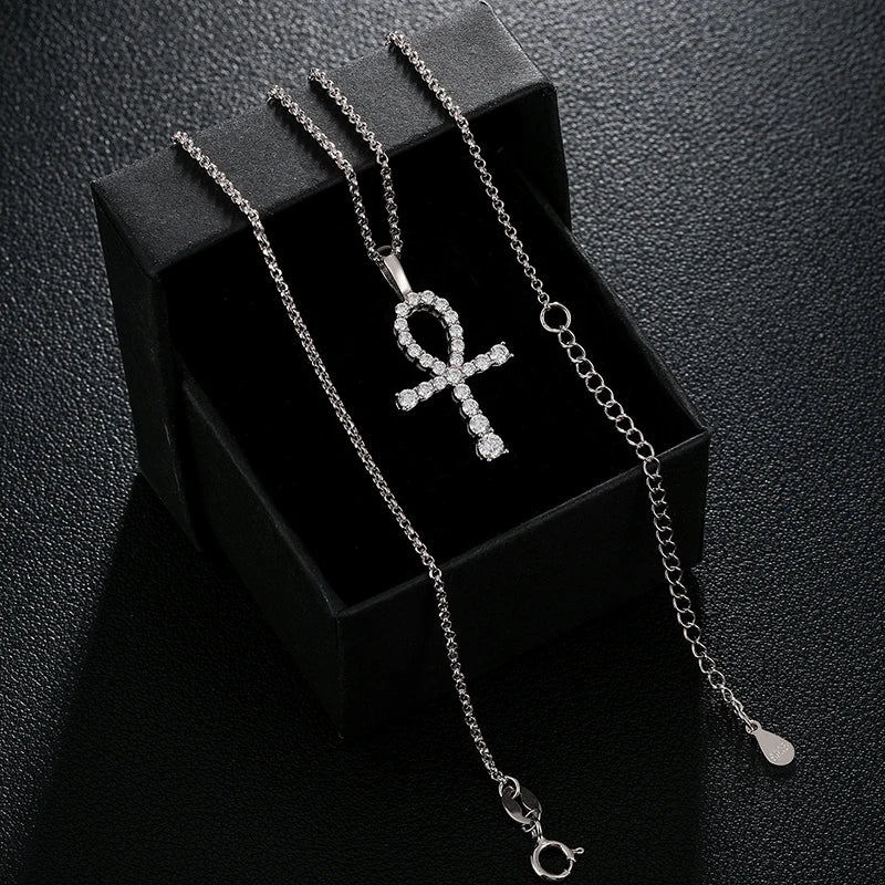 Silver necklace with an Ankh pendant on a black box