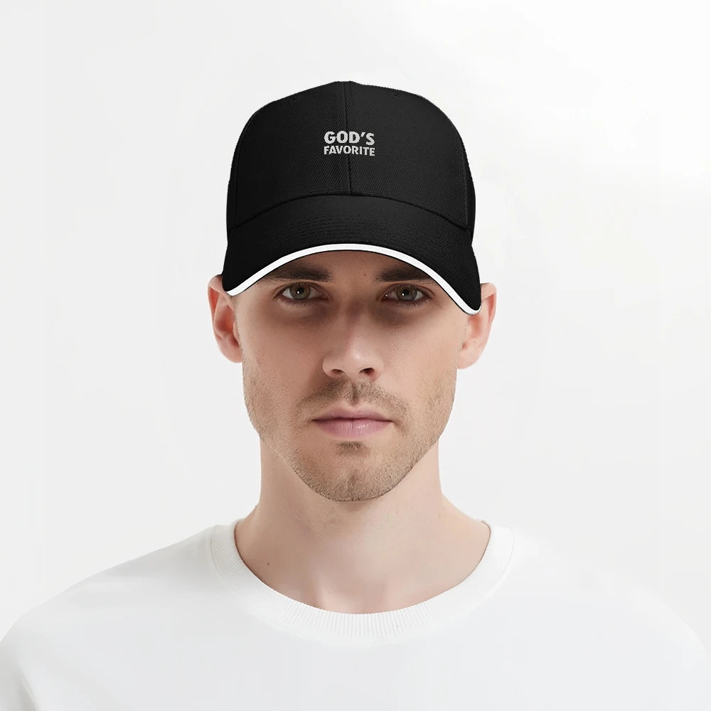 Man wearing a black cap with 'GOD'S FAVORITE' text on a white background