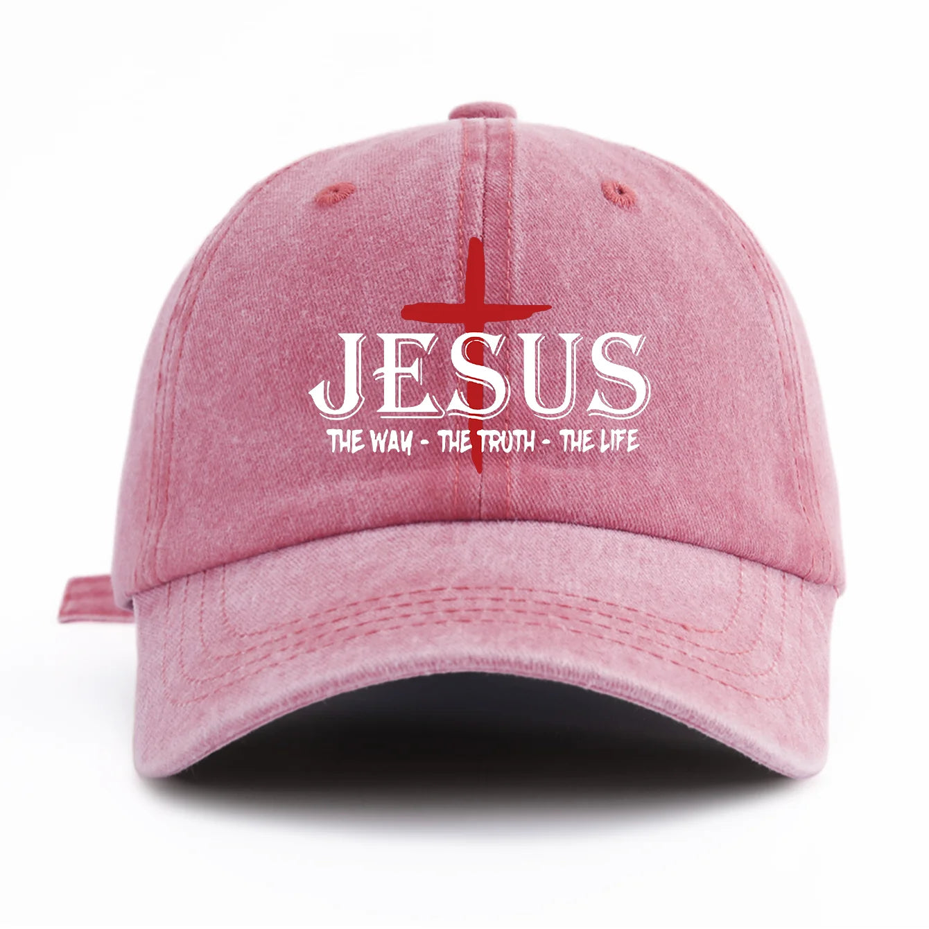Pink cap with 'JESUS THE WAY - THE TRUTH - THE LIFE' text and cross design on a white background