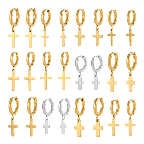 Set of gold and silver hoop earrings with cross pendants on a white background