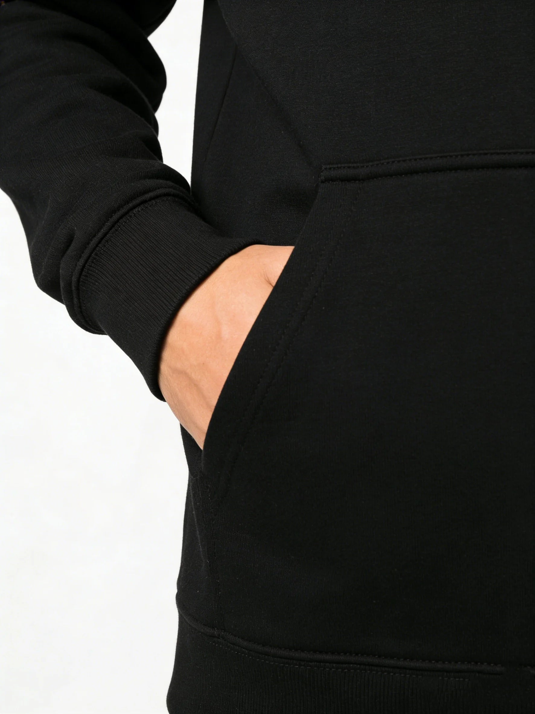 Close-up of a person wearing a black hoodie with a pocket.