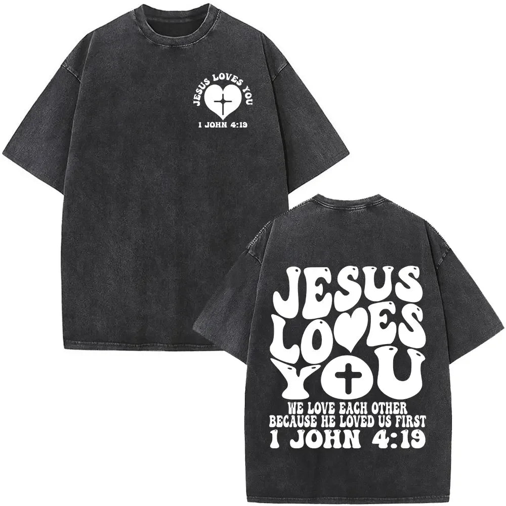 Black t-shirt with 'Jesus Loves You' text and cross design on a white background