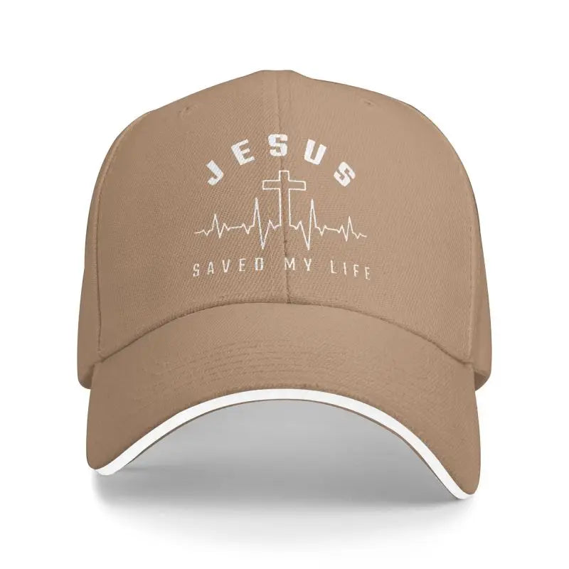 Beige cap with 'Jesus Saved My Life' logo on a white background