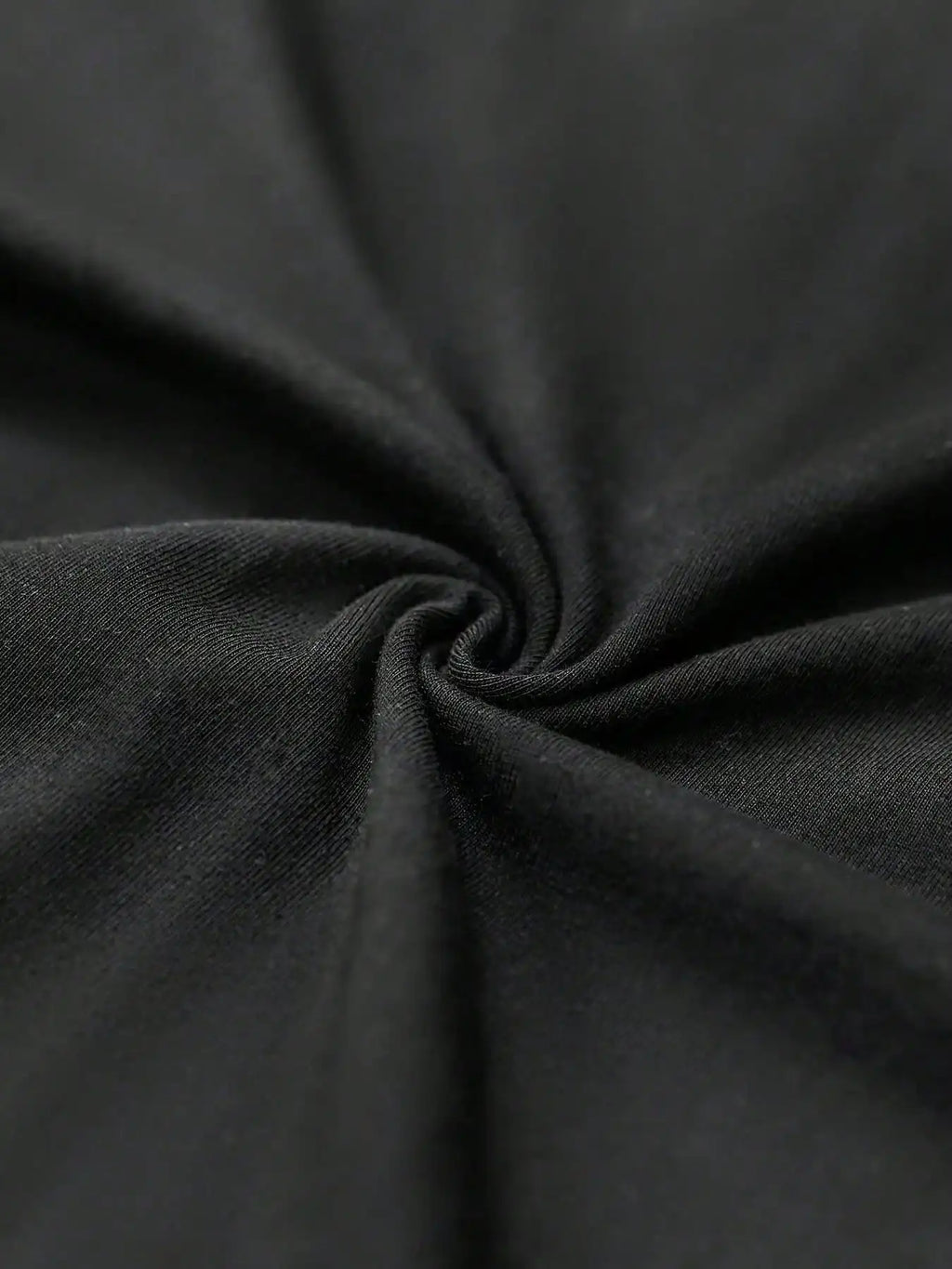 Close-up of dark gray fabric with folds