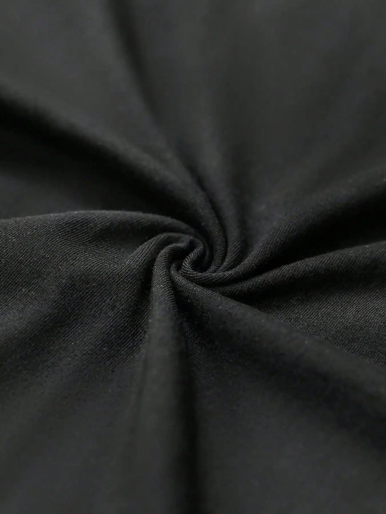 Close-up of dark gray fabric with folds