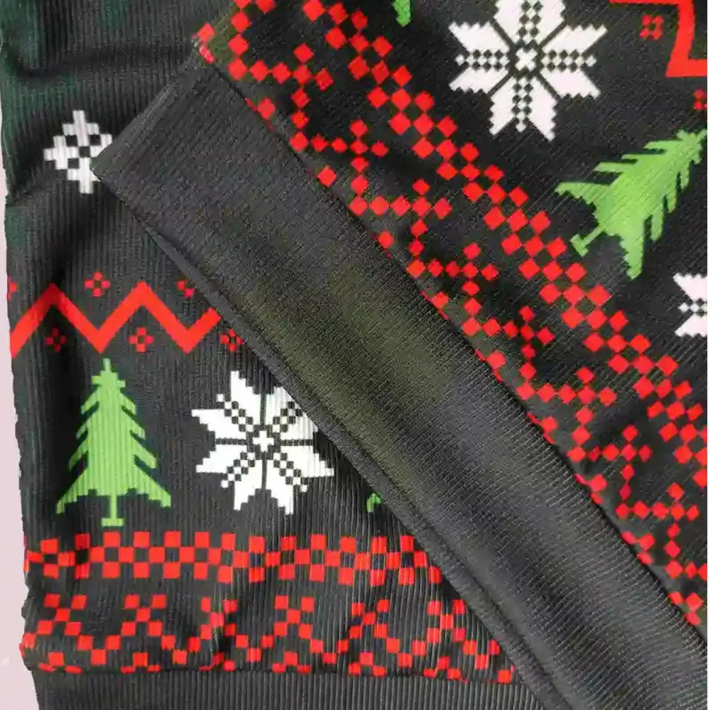 Close-up of a black sweater with red, green, and white Christmas pattern