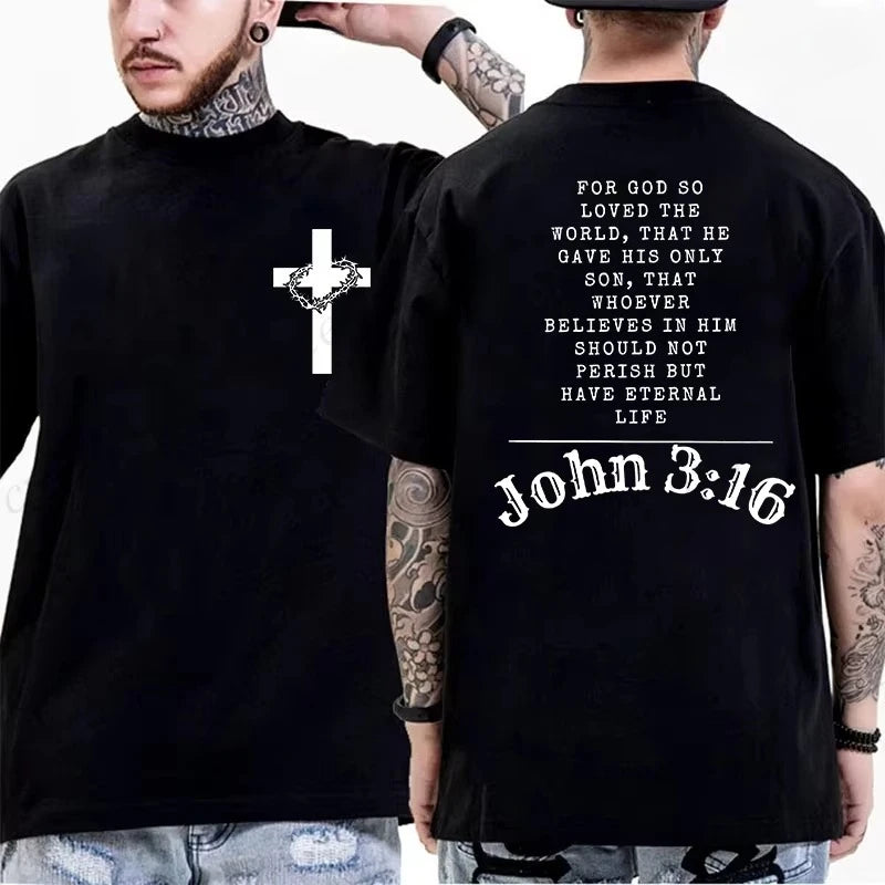 Two people wearing black t-shirts with a cross and Bible verse on a white background