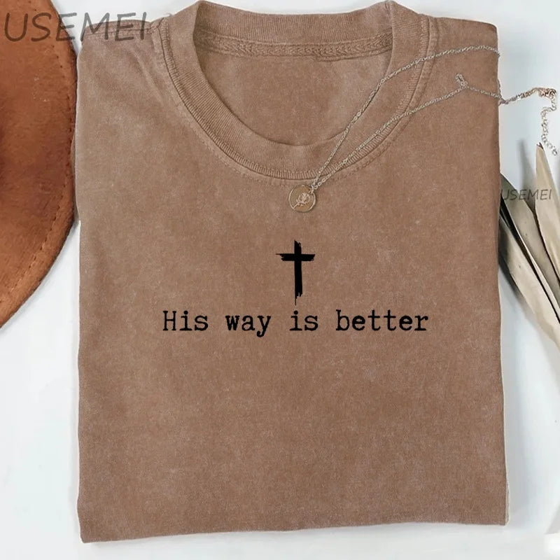 Brown t-shirt with 'His way is better' text and cross symbol on a white background