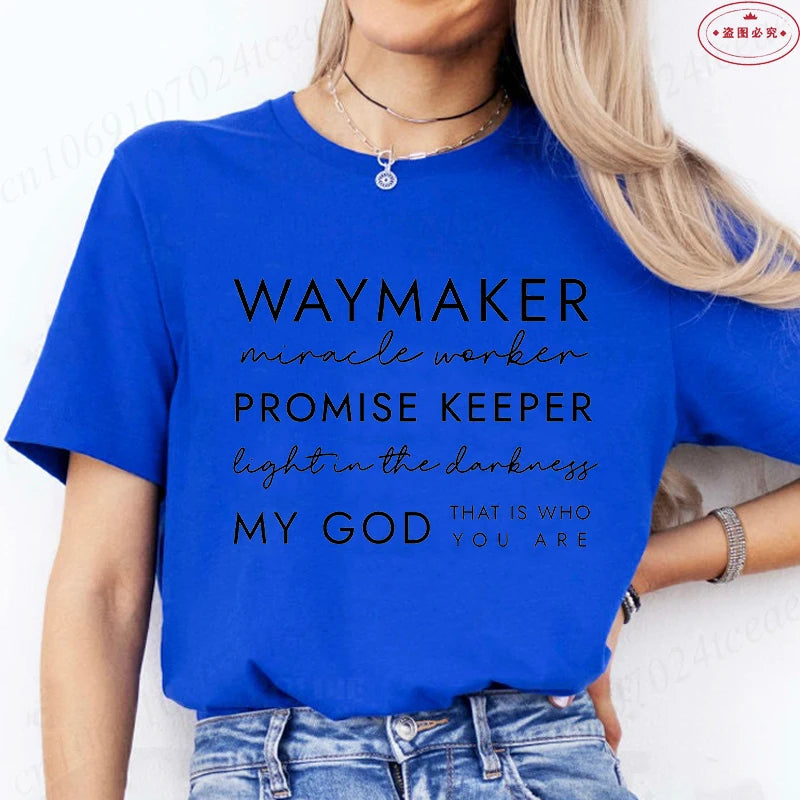 Person wearing a blue t-shirt with motivational text on a white background