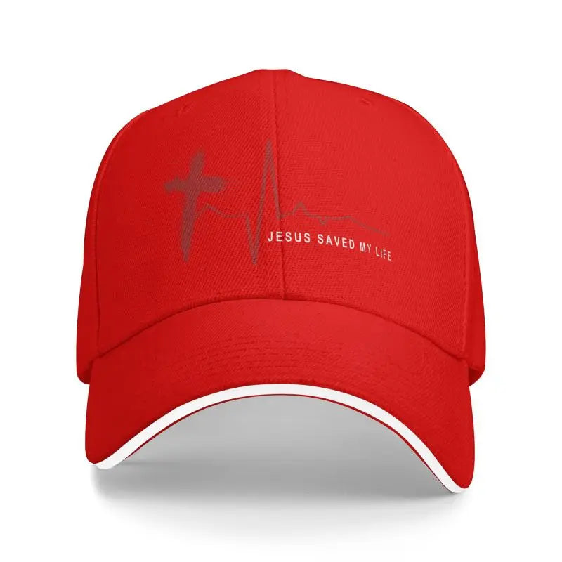 Red cap with cross and heartbeat design, 'Jesus Saved My Life' text on a white background