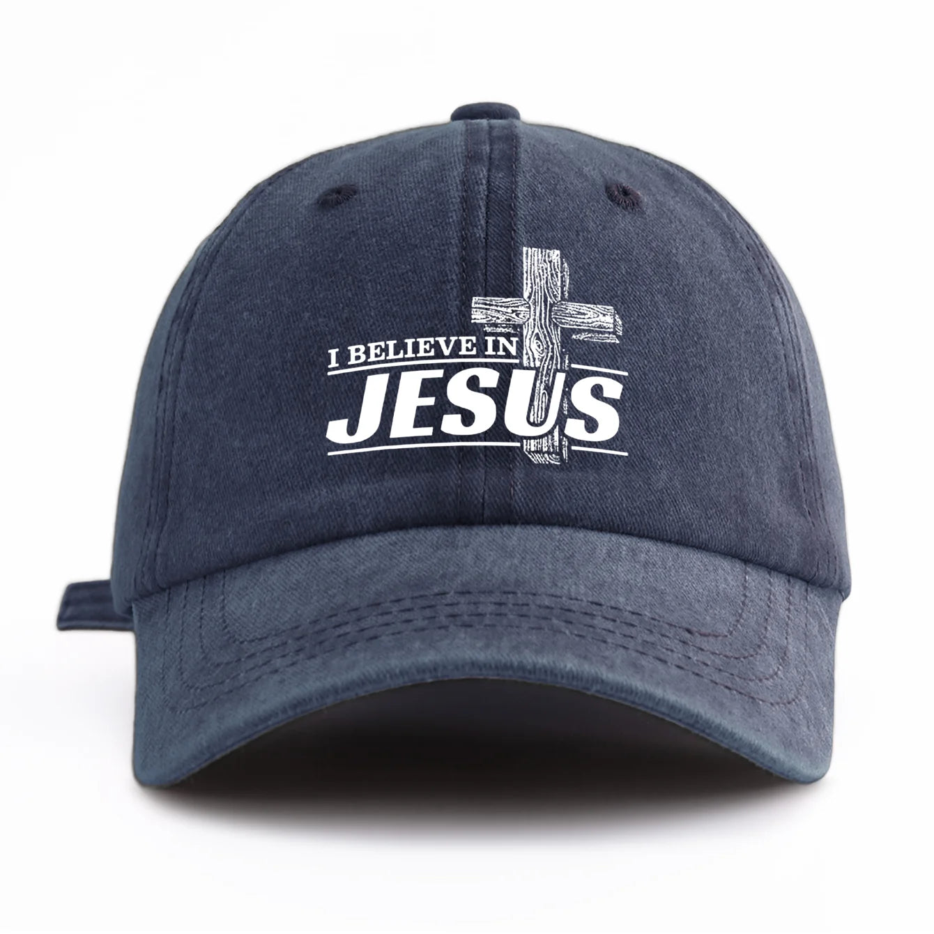 Navy blue cap with 'I Believe in Jesus' text and cross on a white background