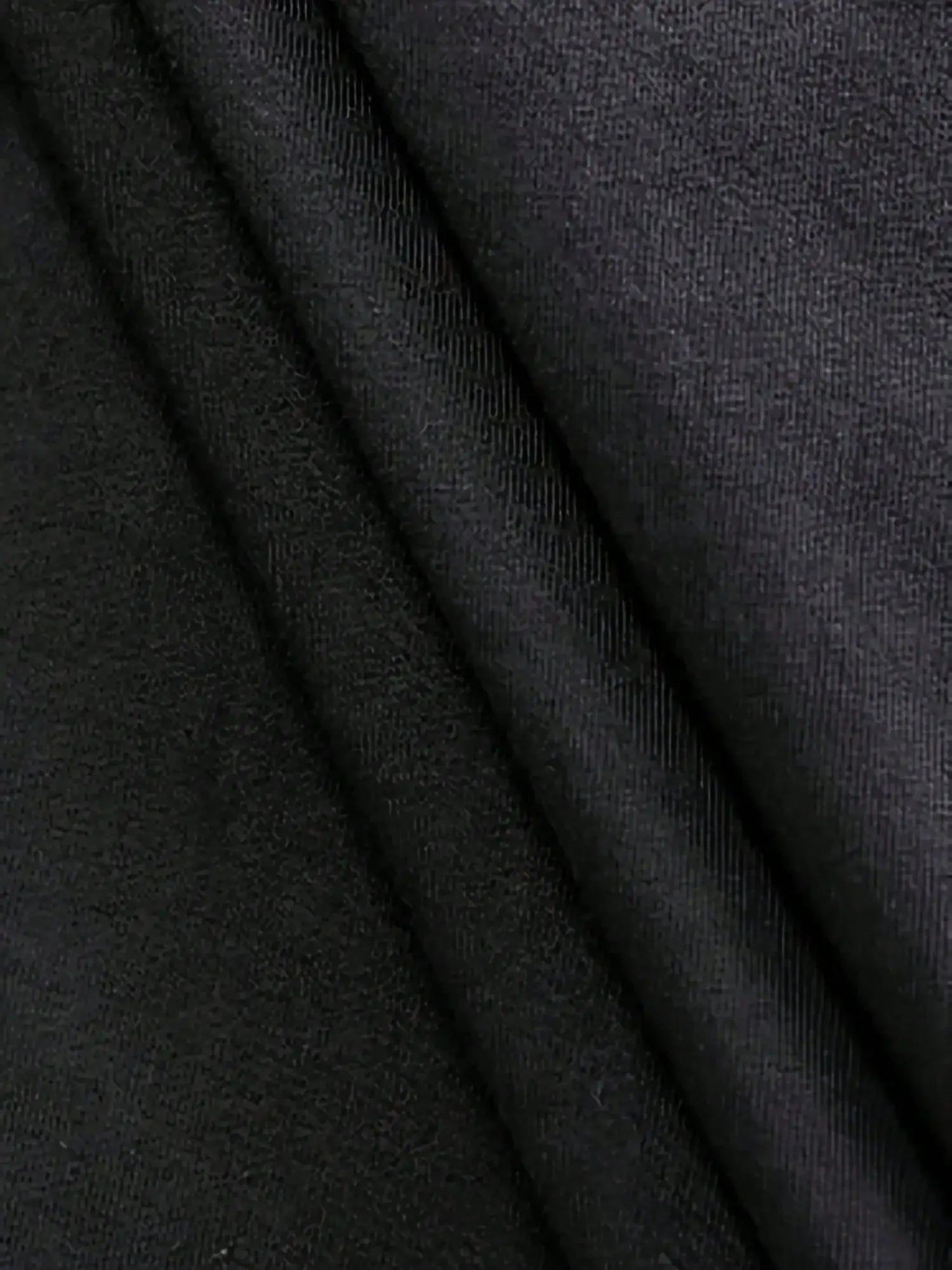 Close-up of dark gray fabric with visible texture