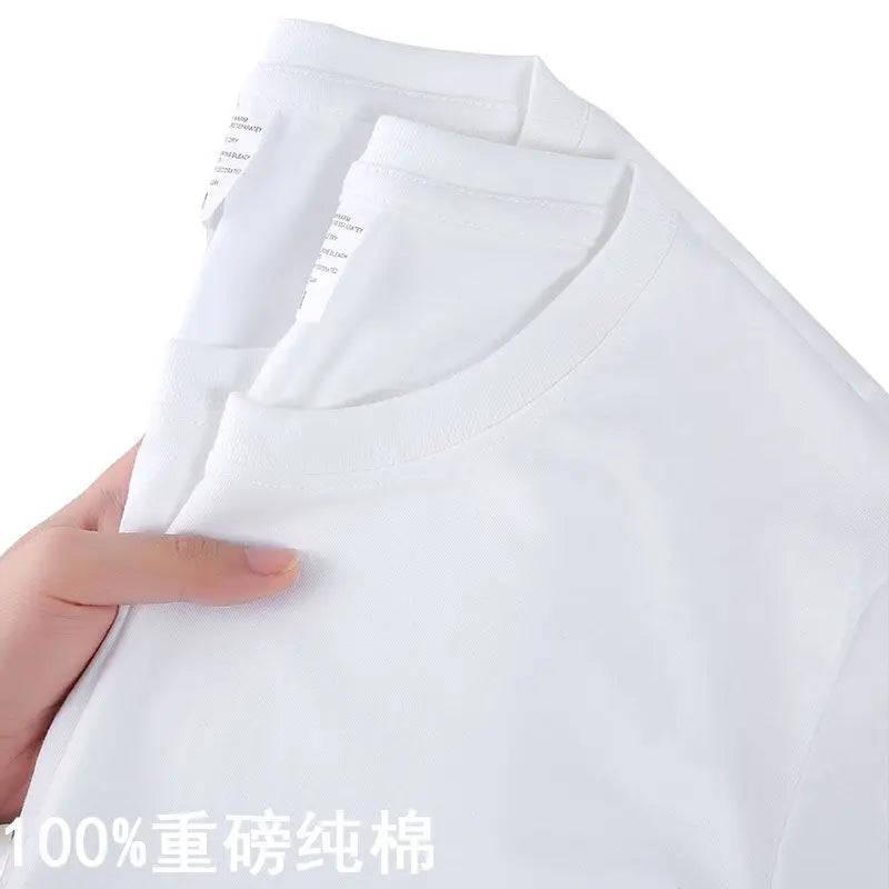 White t-shirt held by a hand with text on a white background