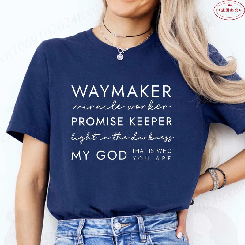 Person wearing a navy blue t-shirt with motivational text on a white background