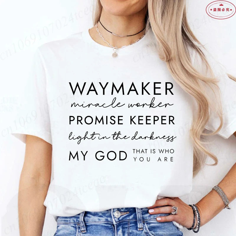 Person wearing a white t-shirt with motivational text design.