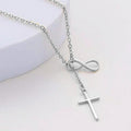 Silver necklace with an infinity symbol and cross pendant on a white background