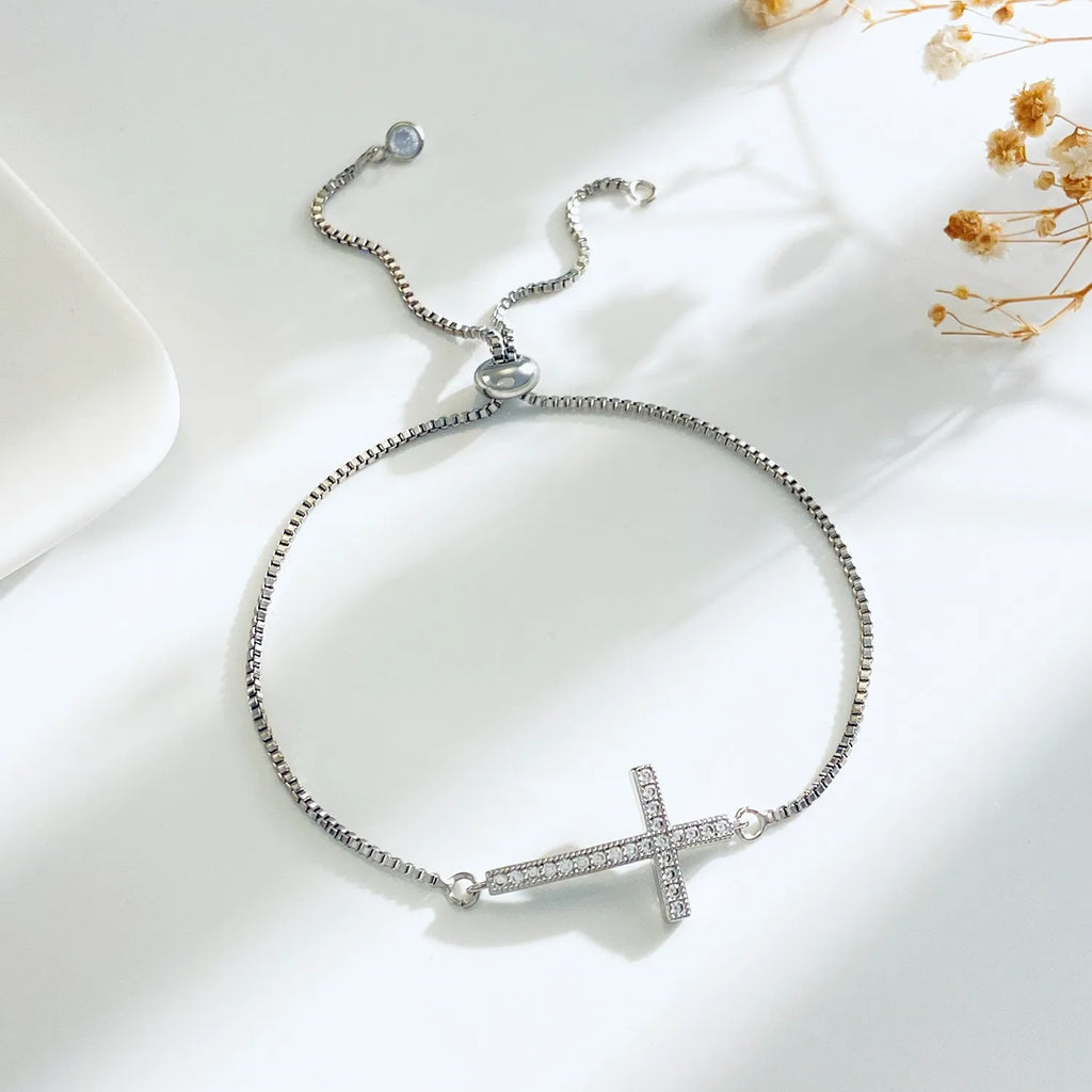 Zircon Cross Bracelet in silver Color A featuring a cross design.