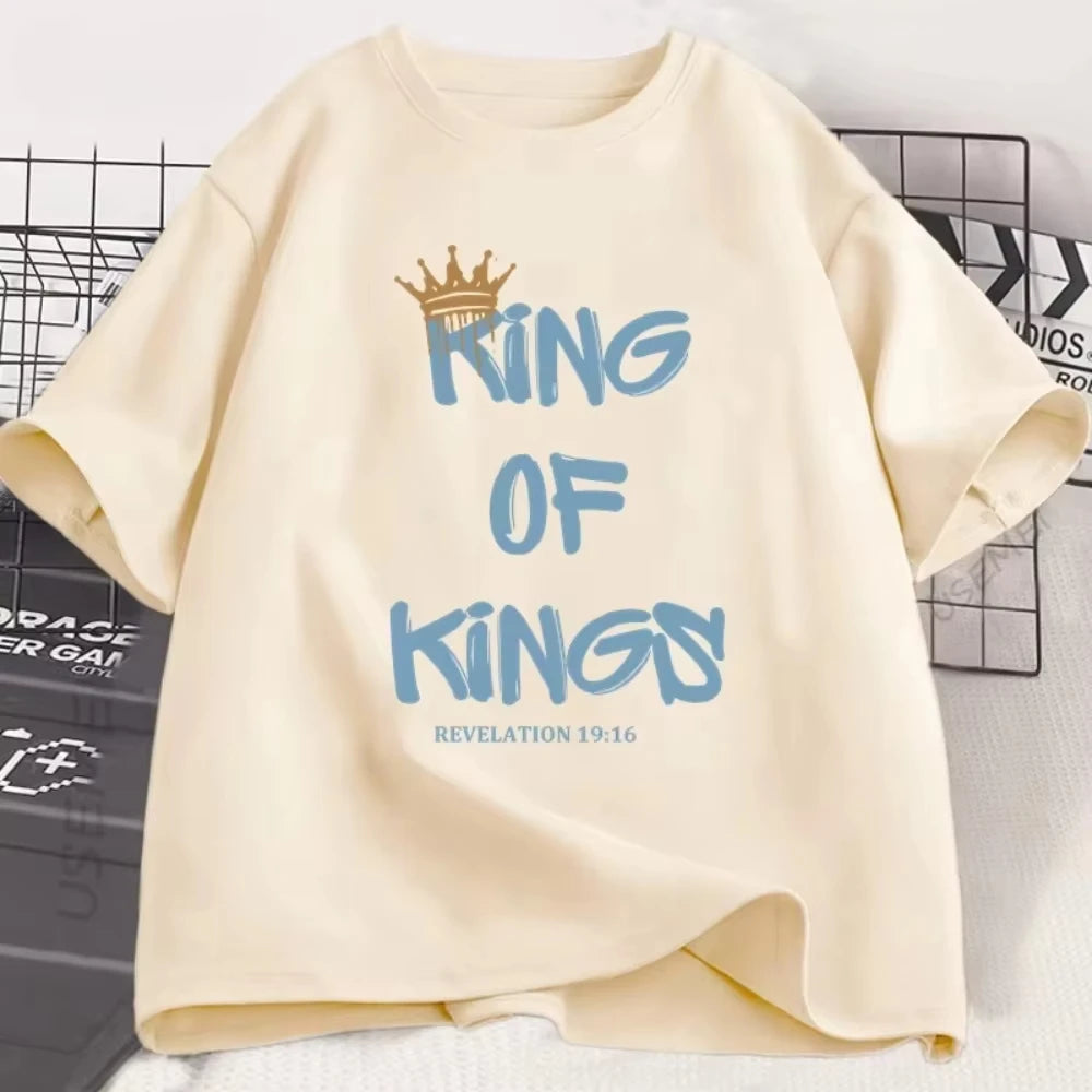 Beige sweatshirt with blue text 'King of Kings' and a crown graphic on a white background.