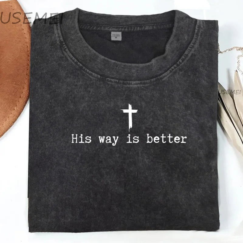 Black t-shirt with a cross and 'His way is better' text on a white background