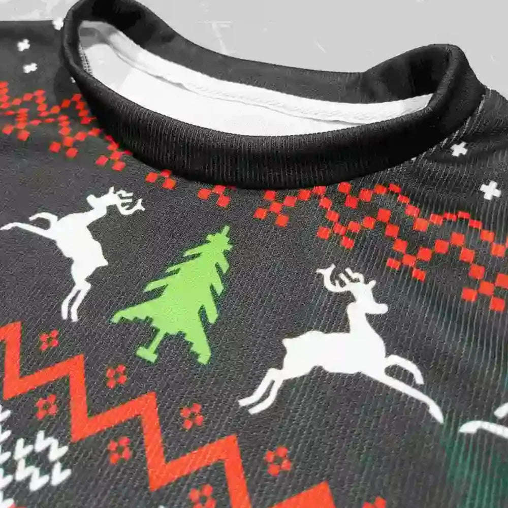 Close-up of a Christmas-themed fabric with reindeer and trees on a gray background