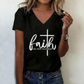 Person wearing a black t-shirt with 'faith can move mountains' text and cross design.