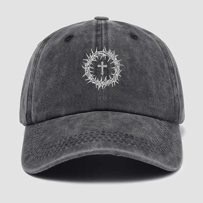 Gray cap with a white cross and crown of thorns emblem on a light gray background