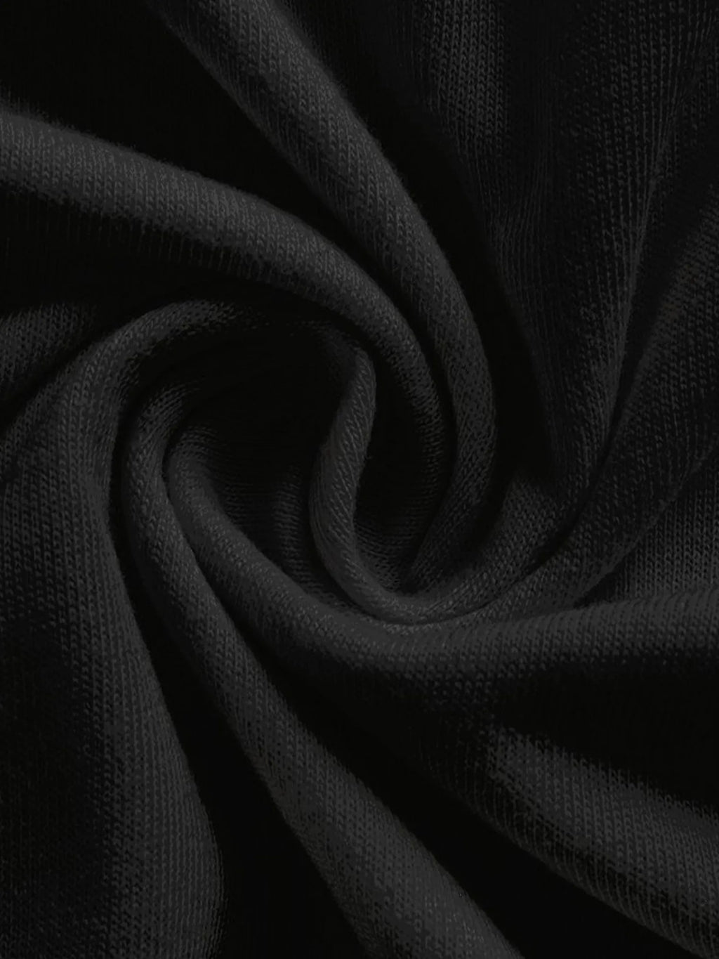 Close-up of black fabric with folds