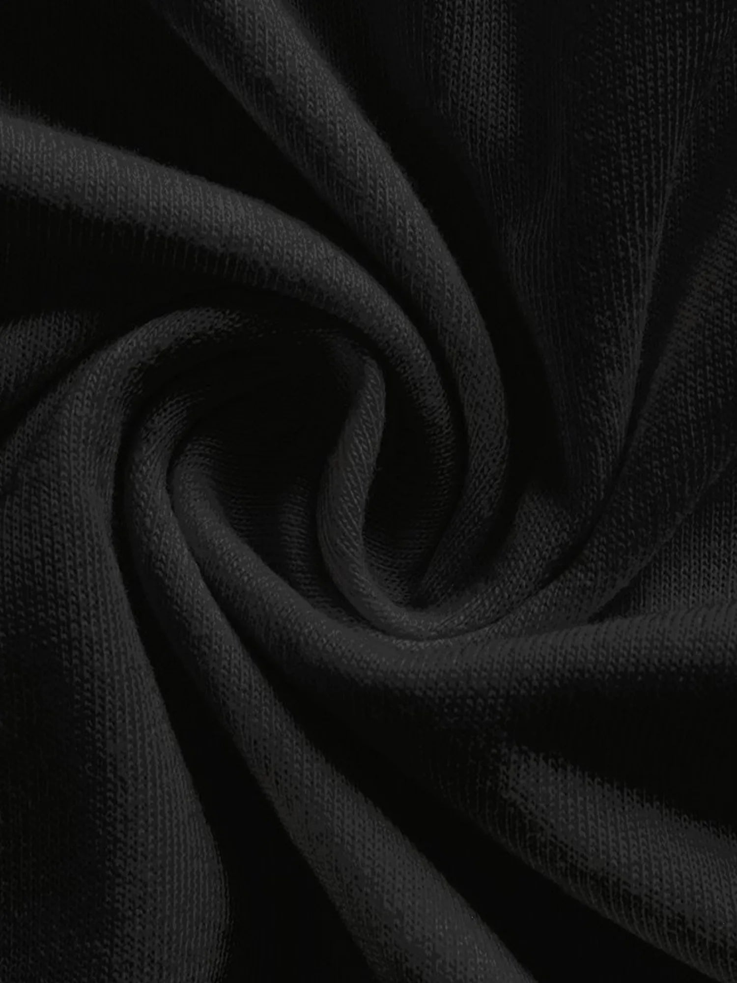 Close-up of black fabric with folds