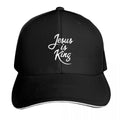 Black cap with 'Jesus is King' text on a white background