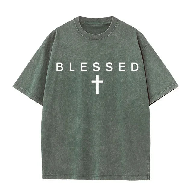 Green t-shirt with 'BLESSED' and a cross on a white background