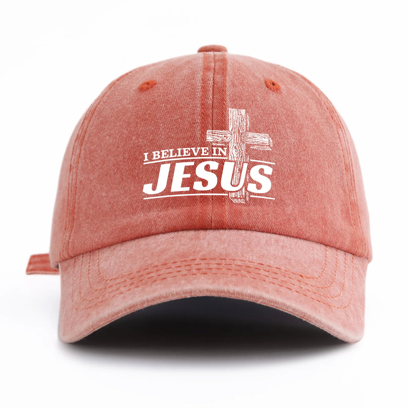 Red/Pink cap with 'I Believe in Jesus' text on a white background