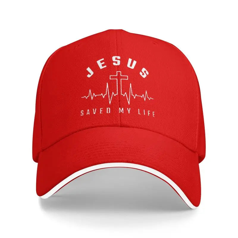 Red cap with 'Jesus Saved My Life' text and cross design on a white background