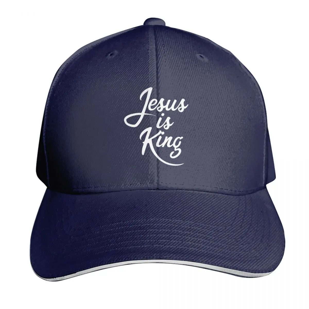 Navy blue cap with 'Jesus is King' text on a white background