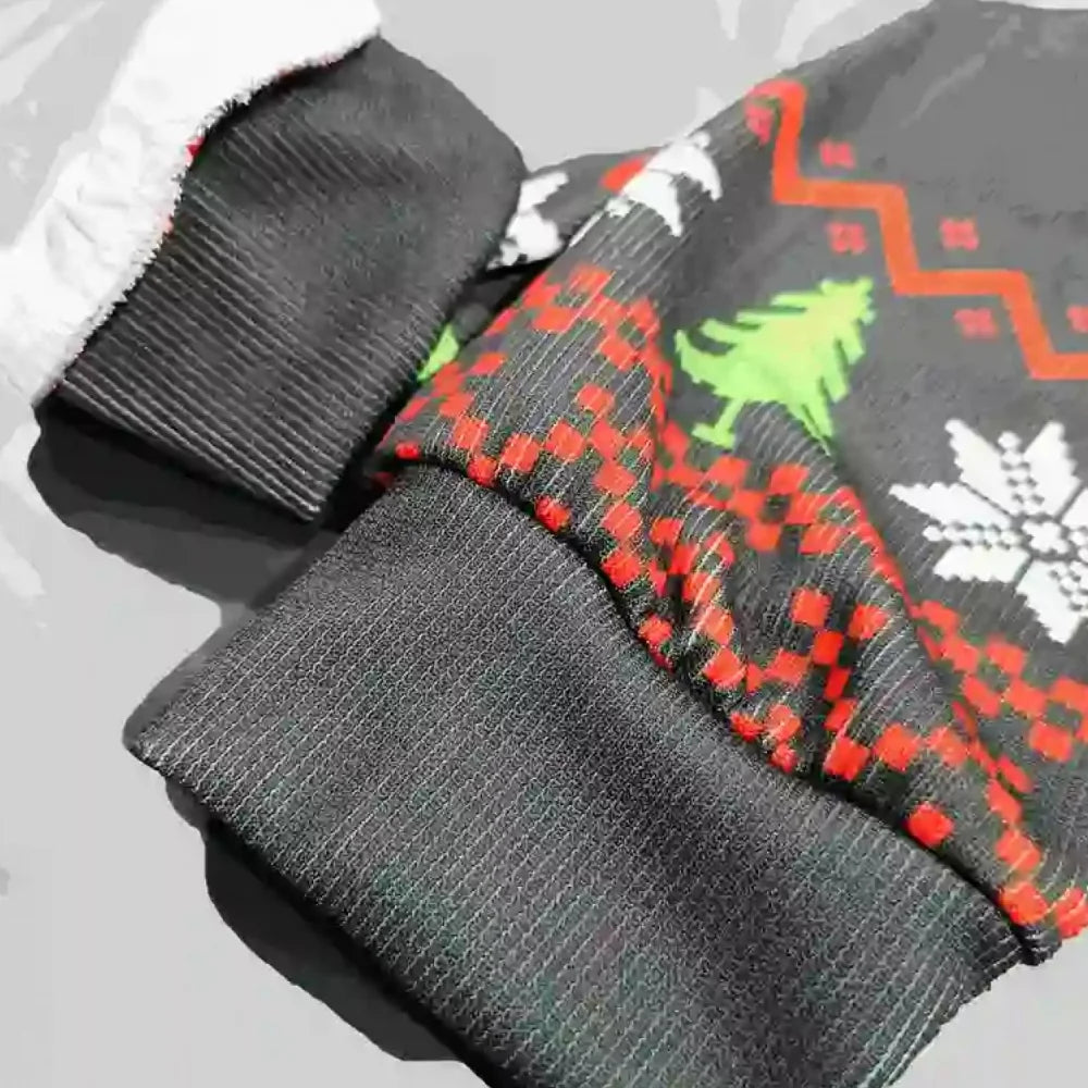 Gray socks with Christmas-themed pattern on a light gray background