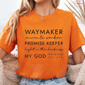 Person wearing an orange t-shirt with motivational text