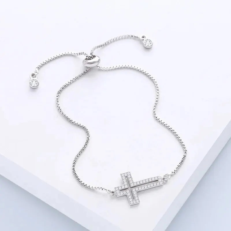 Zircon Cross Bracelet in a flat lay arrangement highlighting its design.