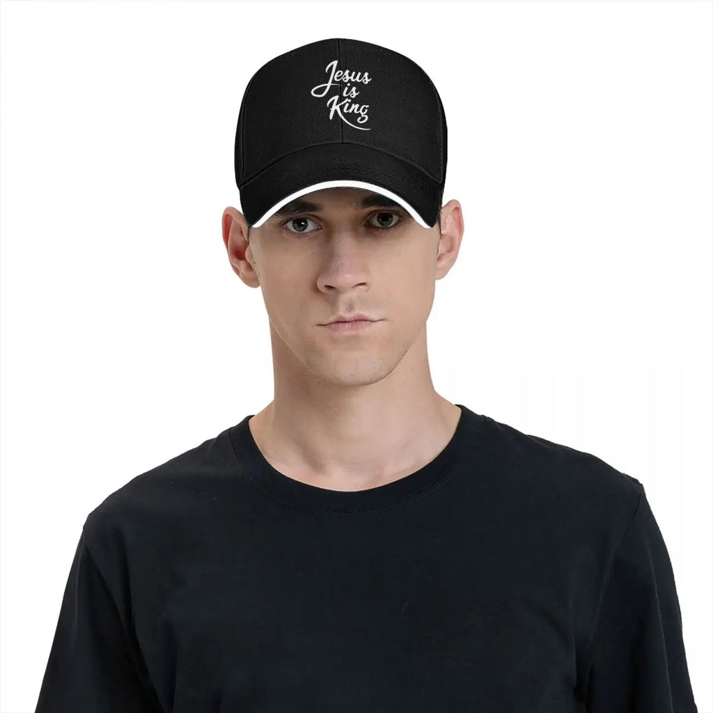 Person wearing a black cap with a butterfly design on a white background