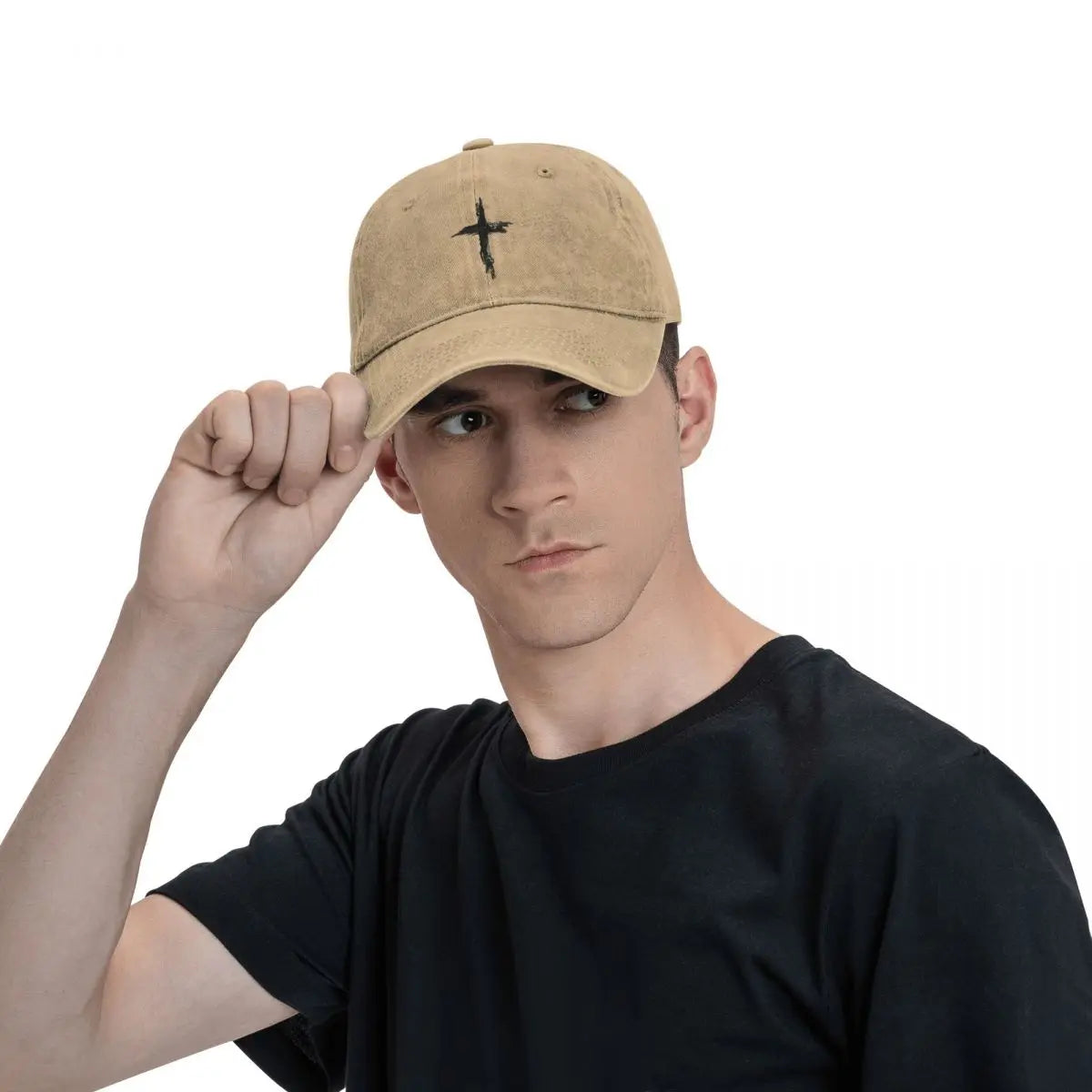Man wearing a beige cap with a cross design on a white background