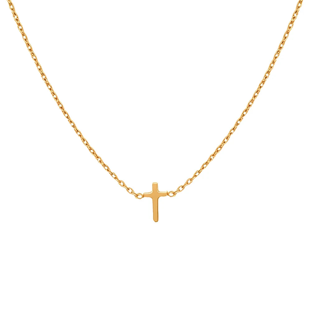 Gold necklace with a small cross pendant on a white background