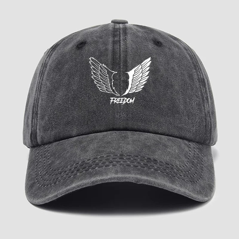 Gray cap with white winged logo and 'Freedom' text on a light gray background